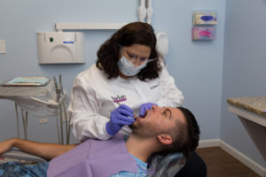 Dentist Raleigh NC Dr. borkan with a patient
